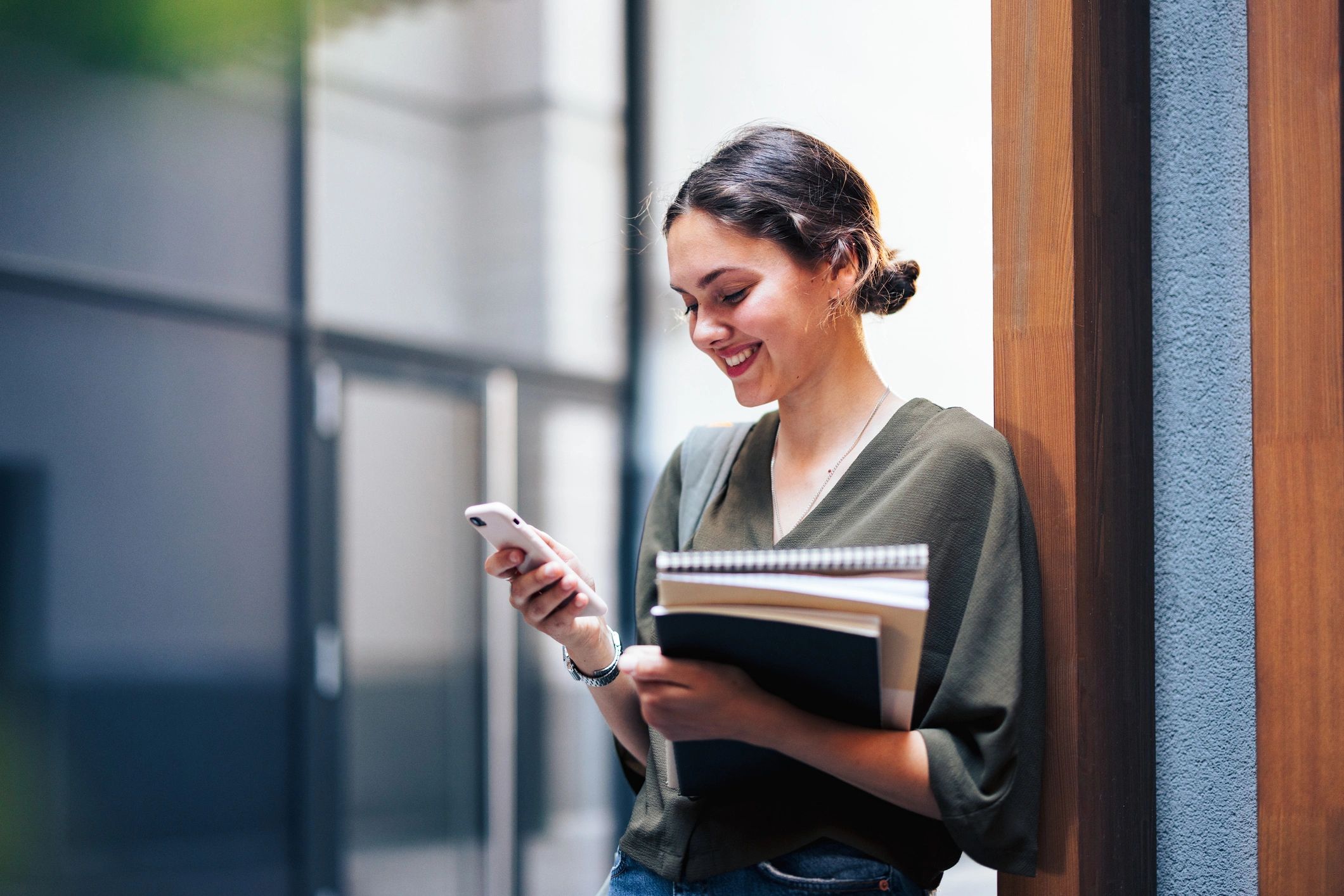 young woman with books campus